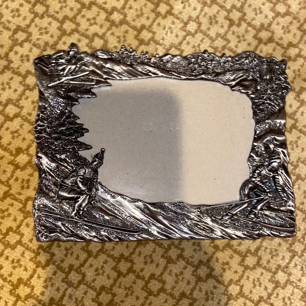 Silver picture frame with skier